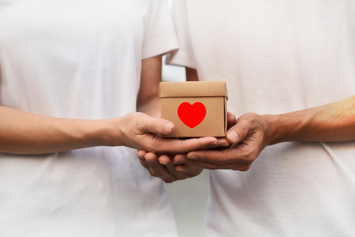 Man Giving Gift Box to Woman